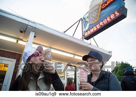 Stock Photo - Hikers enjoying ice cream cone at cafe, Lake Blanco, Washington, USA. Fotosearch