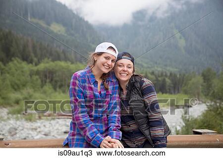 Hikers posing against forest in background, Lake Blanco, Washington, USA View Large Photo Image Stock Image - Hikers posing against forest in background, Lake Blanco, Washington, USA. Fotosearch