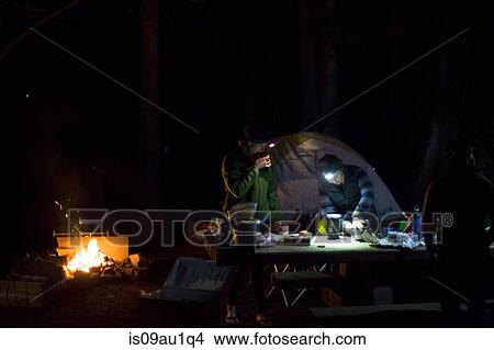 Hikers preparing dinner at camp View Large Photo Image Picture - Hikers preparing dinner at camp. Fotosearch