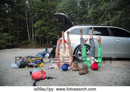 Hikers stretching beside vehicle in forest, Lake Blanco, Washington, USA View Large Photo Image Stock Photo - Hikers stretching beside vehicle in forest, Lake Blanco, Washington, USA. Fotosearch