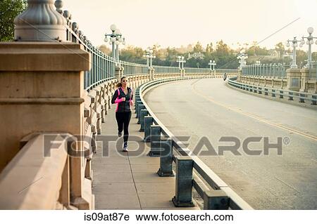 Jogger running on bridge, Arroyo Seco Park, Pasadena, California, USA View Large Photo Image Stock Image - Jogger running on bridge, Arroyo Seco Park, Pasadena, California, USA. Fotosearch