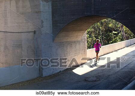 Jogger running on bridge, Arroyo Seco Park, Pasadena, California, USA View Large Photo Image Stock Photo - Jogger running on bridge, Arroyo Seco Park, Pasadena, California, USA. Fotosearch