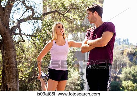 Stock Image - Jogger stretching, Arroyo Seco Park, Pasadena, California, USA. Fotosearch