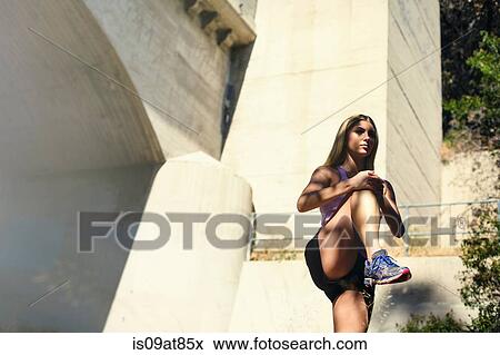 Stock Photo - Jogger stretching, Arroyo Seco Park, Pasadena, California, USA. Fotosearch