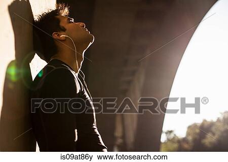 Stock Photo - Jogger taking break under arch bridge, Arroyo Seco Park, Pasadena, California, USA. Fotosearch