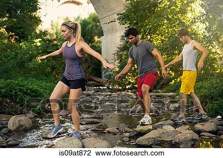 Joggers crossing stream under arch bridge, Arroyo Seco Park, Pasadena, California, USA View Large Photo Image Stock Image - Joggers crossing stream under arch bridge, Arroyo Seco Park, Pasadena, California, USA. Fotosearch