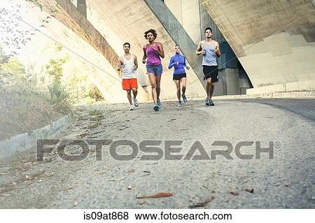 Stock Photo - Joggers running on bridge, Arroyo Seco Park, Pasadena, California, USA. Fotosearch