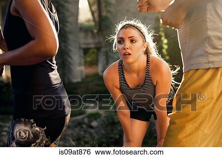 Joggers running past jogger taking break, Arroyo Seco Park, Pasadena, California, USA View Large Photo Image Stock Photograph - Joggers running past jogger taking break, Arroyo Seco Park, Pasadena, California, USA. Fotosearch