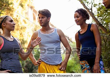 Stock Photo - Joggers standing and chatting, Arroyo Seco Park, Pasadena, California, USA. Fotosearch