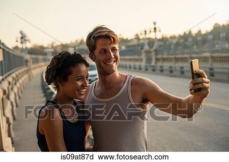 Joggers taking selfie on bridge, Arroyo Seco Park, Pasadena, California, USA View Large Photo Image Stock Image - Joggers taking selfie on bridge, Arroyo Seco Park, Pasadena, California, USA. Fotosearch