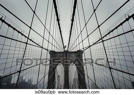 Low angle view of Brooklyn Bridge symmetry, New York, USA View Large Photo Image Stock Image - Low angle view of Brooklyn Bridge symmetry, New York, USA. Fotosearch
