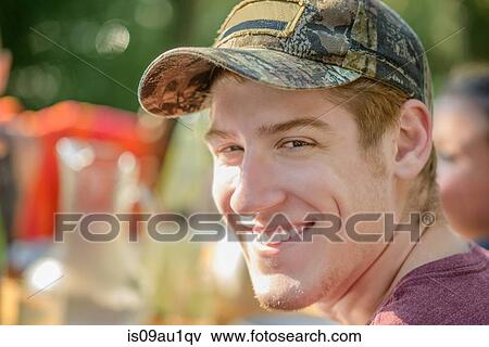 Stock Photo - Man smiling at tomato eating festival. Fotosearch