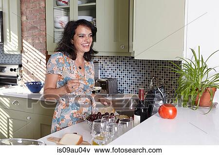 Mature woman preparing hummus in kitchen View Large Photo Image Stock Photo - Mature woman preparing hummus in kitchen. Fotosearch