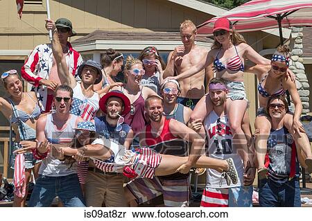 Stock Photography - Portrait of adult friends celebrating Independence Day, USA. Fotosearch
