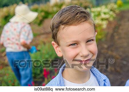 Portrait of boy in front of great grandmother on farm View Large Photo Image Stock Photography - Portrait of boy in front of great grandmother on farm. Fotosearch
