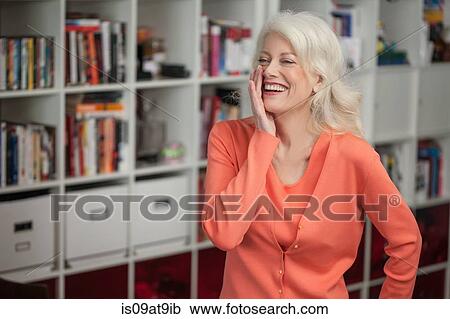 Portrait of mature woman, laughing, indoors View Large Photo Image Stock Image - Portrait of mature woman, laughing, indoors. Fotosearch