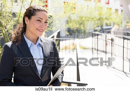 Portrait of mid adult businesswoman, outdoors View Large Photo Image Stock Image - Portrait of mid adult businesswoman, outdoors. Fotosearch