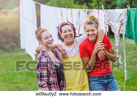 Portrait of mother with two daughters, outdoors View Large Photo Image Stock Image - Portrait of mother with two daughters, outdoors. Fotosearch