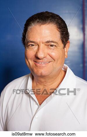 Portrait of senior man (table tennis player) wearing white polo shirt looking at camera smiling View Large Photo Image Stock Photo - Portrait of senior man (table tennis player) wearing white polo shirt looking at camera smiling. Fotosearch