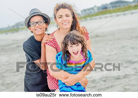 Portrait of woman and children on beach View Large Photo Image Stock Photography - Portrait of woman and children on beach. Fotosearch