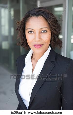 Stock Photography - Portrait of young businesswoman, outdoors. Fotosearch