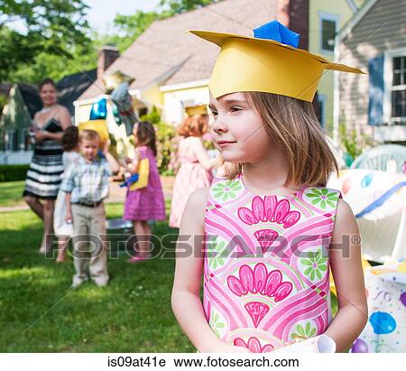 Portrait of young girl at kindergarten graduation, wearing paper mortar board View Large Photo Image Stock Image - Portrait of young girl at kindergarten graduation, wearing paper mortar board. Fotosearch