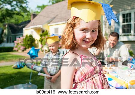 Portrait of young girl at kindergarten graduation, wearing paper mortar board View Large Photo Image Stock Photograph - Portrait of young girl at kindergarten graduation, wearing paper mortar board. Fotosearch
