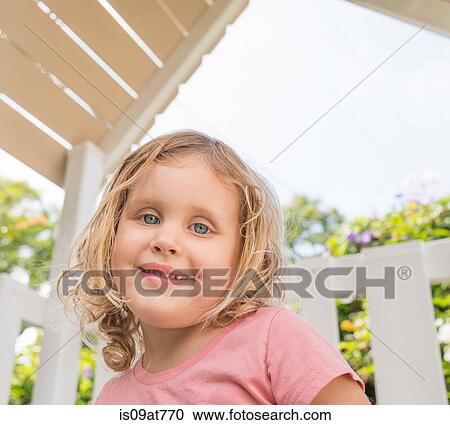 Portrait of young girl, smiling, outdoors View Large Photo Image Stock Image - Portrait of young girl, smiling, outdoors. Fotosearch