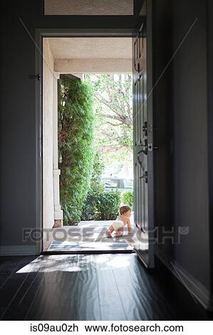 Rear view of baby boy wearing nappy crawling through open front door View Large Photo Image Stock Image - Rear view of baby boy wearing nappy crawling through open front door. Fotosearch