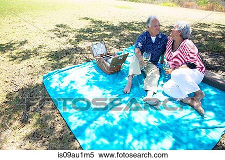 Senior couple having picnic outdoors View Large Photo Image Stock Photography - Senior couple having picnic outdoors. Fotosearch