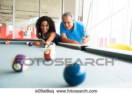 Senior man and wife playing on pool table View Large Photo Image Stock Photography - Senior man and wife playing on pool table. Fotosearch
