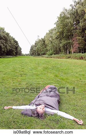Senior woman inside sleeping bag, in field, arms stretched out View Large Photo Image Stock Image - Senior woman inside sleeping bag, in field, arms stretched out. Fotosearch