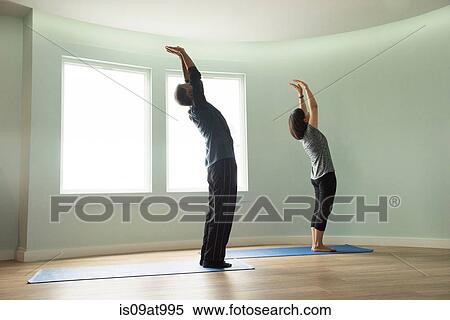 Side view of mature couple reaching upwards stretching arms bending backwards View Large Photo Image Stock Photography - Side view of mature couple reaching upwards stretching arms bending backwards. Fotosearch