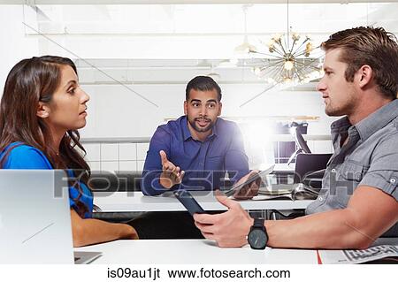 Small group of people having business meeting, male and female colleagues having disasgreement View Large Photo Image Stock Photograph - Small group of people having business meeting, male and female colleagues having disasgreement. Fotosearch