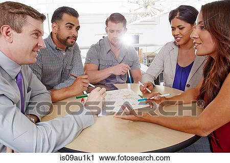 Small group of people having brainstorming business meeting View Large Photo Image Stock Image - Small group of people having brainstorming business meeting. Fotosearch