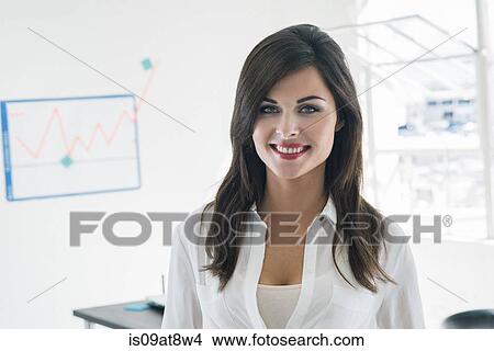 Smiling businesswoman by office window View Large Photo Image Picture - Smiling businesswoman by office window. Fotosearch