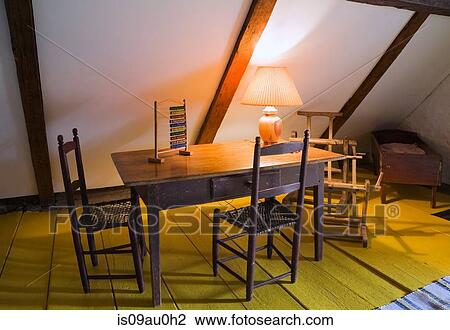 Table and chairs in room with wood beamed vaulted ceiling View Large Photo Image Stock Image - Table and chairs in room with wood beamed vaulted ceiling. Fotosearch