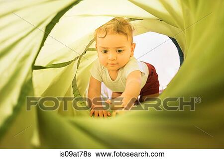 Toddler crawling through play tube View Large Photo Image Stock Photograph - Toddler crawling through play tube. Fotosearch