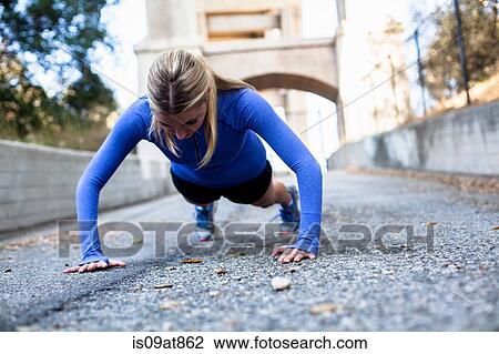 Woman doing push ups on bridge, Arroyo Seco Park, Pasadena, California, USA View Large Photo Image Stock Image - Woman doing push ups on bridge, Arroyo Seco Park, Pasadena, California, USA. Fotosearch