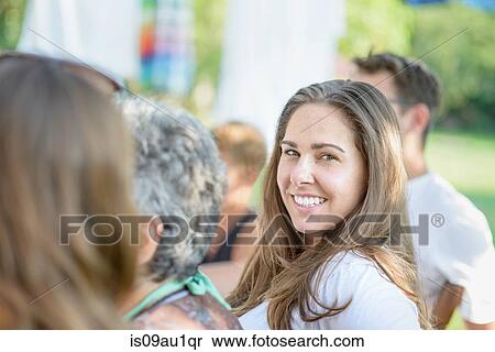 Woman smiling at tomato eating festival View Large Photo Image Stock Photography - Woman smiling at tomato eating festival. Fotosearch