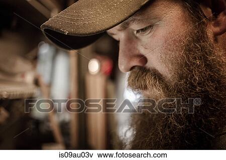 Stock Photo - Wood artist in workshop, close-up. Fotosearch