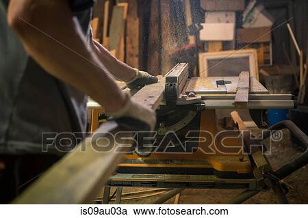 Wood artist in workshop, using woodworking machinery, mid section View Large Photo Image Stock Image - Wood artist in workshop, using woodworking machinery, mid section. Fotosearch