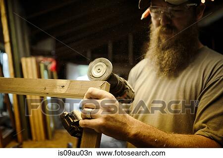 Wood artist working in workshop View Large Photo Image Picture - Wood artist working in workshop. Fotosearch