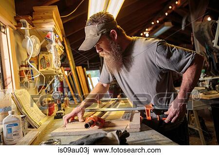 Wood artist working in workshop View Large Photo Image Stock Image - Wood artist working in workshop. Fotosearch