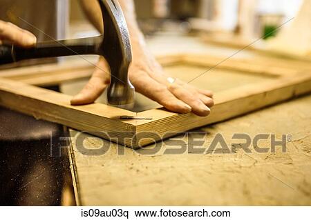 Wood artist working in workshop, using hammer, close-up View Large Photo Image Stock Photography - Wood artist working in workshop, using hammer, close-up. Fotosearch