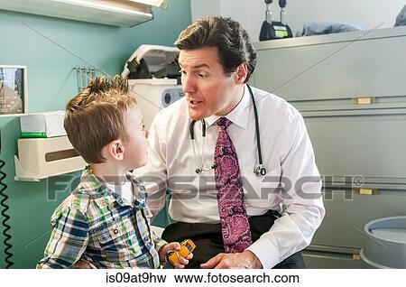 Young boy having check-up in doctor's office View Large Photo Image Stock Photo - Young boy having check-up in doctor's office. Fotosearch