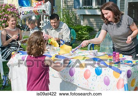 Young girl receiving certificate at kindergarten graduation View Large Photo Image Stock Image - Young girl receiving certificate at kindergarten graduation. Fotosearch