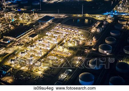 Aerial view of oil refinery and storage tanks illuminated at night, Los Angeles, California, USA View Large Photo Image Stock Image - Aerial view of oil refinery and storage tanks illuminated at night, Los Angeles, California, USA. Fotosearch