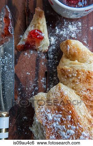 Stock Photograph - Croissant with jam, overhead view. Fotosearch