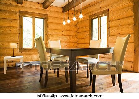 Dining table and chairs with modern lighting in Eastern white pine log cabin View Large Photo Image Stock Photography - Dining table and chairs with modern lighting in Eastern white pine log cabin. Fotosearch